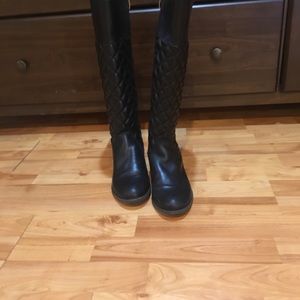 Below the knee leather boots.